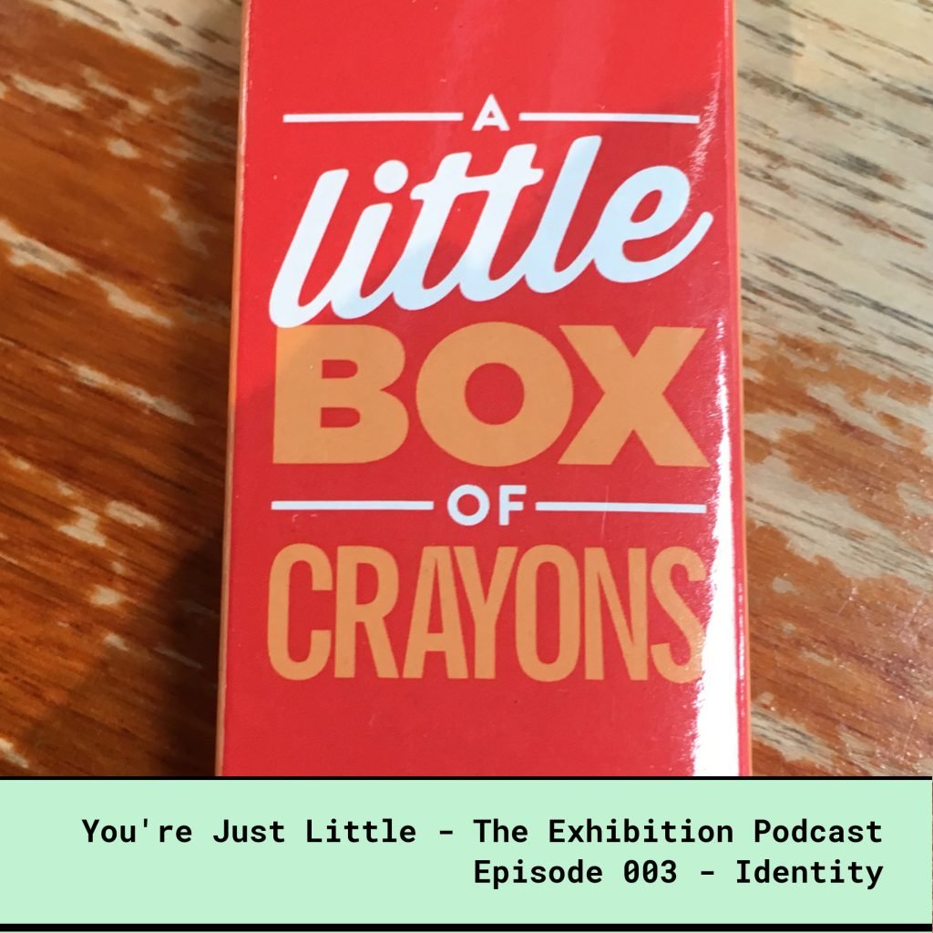 You're Just Little -The Exhibition Podcast - Episode 3 - Identity - Red box of crayons with the words A Little Box of Crayons